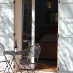 The patio outside Tunisia, one of the bedrooms in the Little House at 10pm in Burgundy with a fine bottle of Domaine Bachey-Legros Sous la Roche